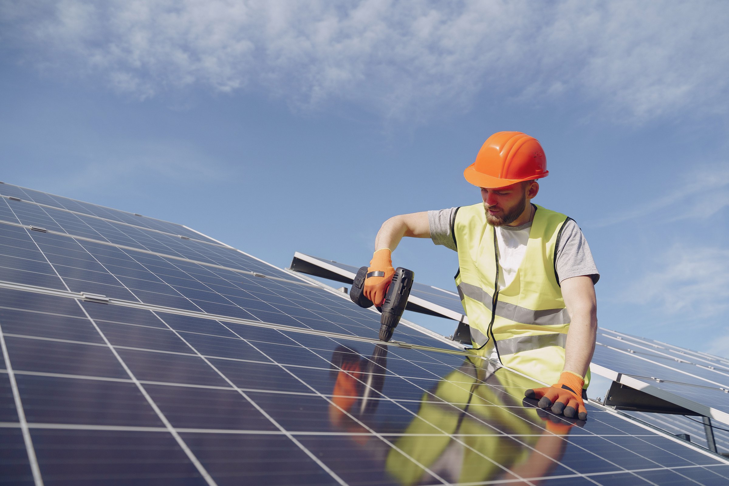 Solar Technician Installing Solar Panel